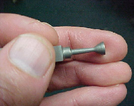 Small machined part in hand